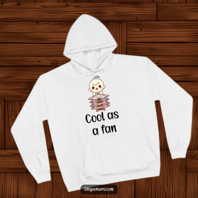 Funny hoodie with a happy character balancing a stack of decorative fans, offering cozy style and playful sophistication.