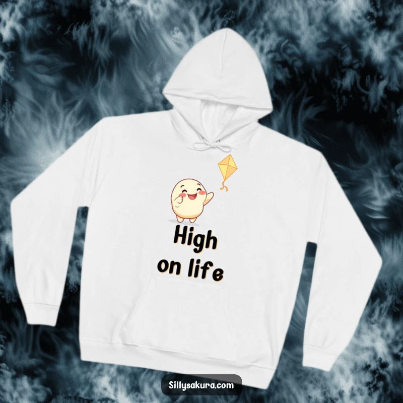 Funny hoodie with a grinning character enthusiastically pointing at a dancing paper kite, offering cozy comfort and a touch of playful, humorous design.