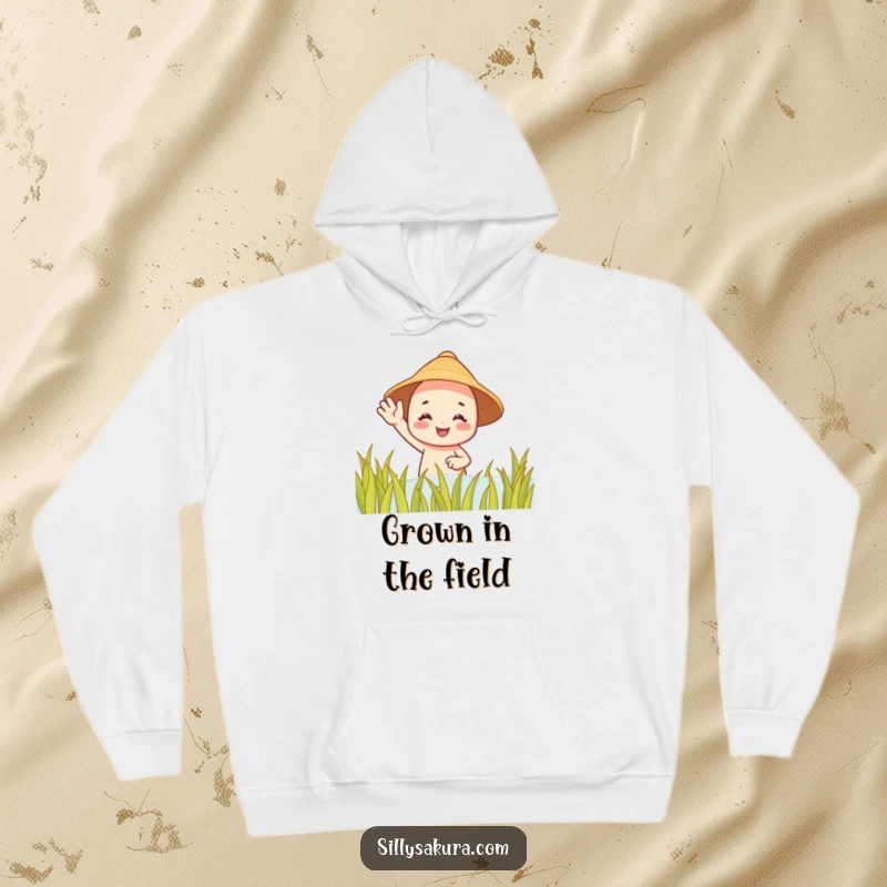 Funny hoodie: a smiling character in a straw hat waves from a serene rice paddy, offering warmth and humor.