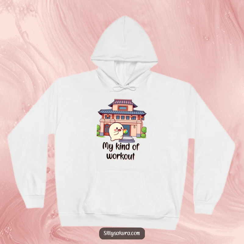 Funny Hoodie featuring a rounded character actively bouncing a colorful ball against a building with a joyful expression.