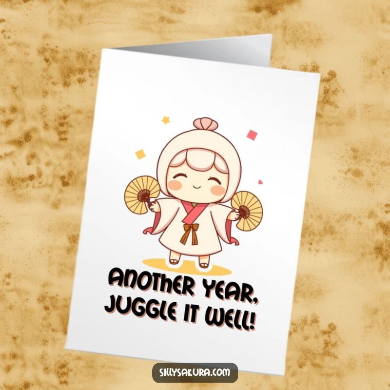 Funny Free Printable Birthday Card depicting a cute Kokeshi doll character skillfully juggling three small, colorful fans with a happy expression.