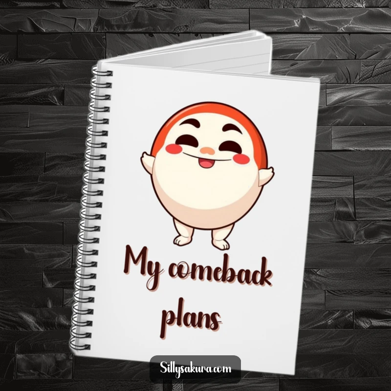 Funny notebook with a determined Daruma doll character smiling confidently, ready to record goals and plans.