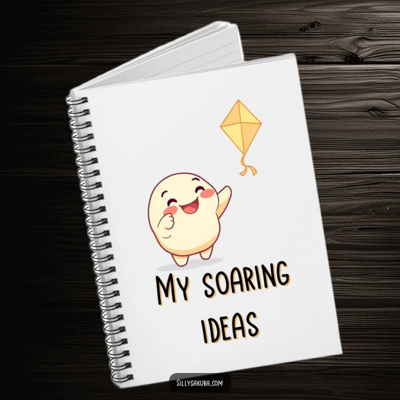 Funny notebook with a grinning character enthusiastically pointing at a dancing paper kite, encouraging creative thinking and capturing joyful ideas.