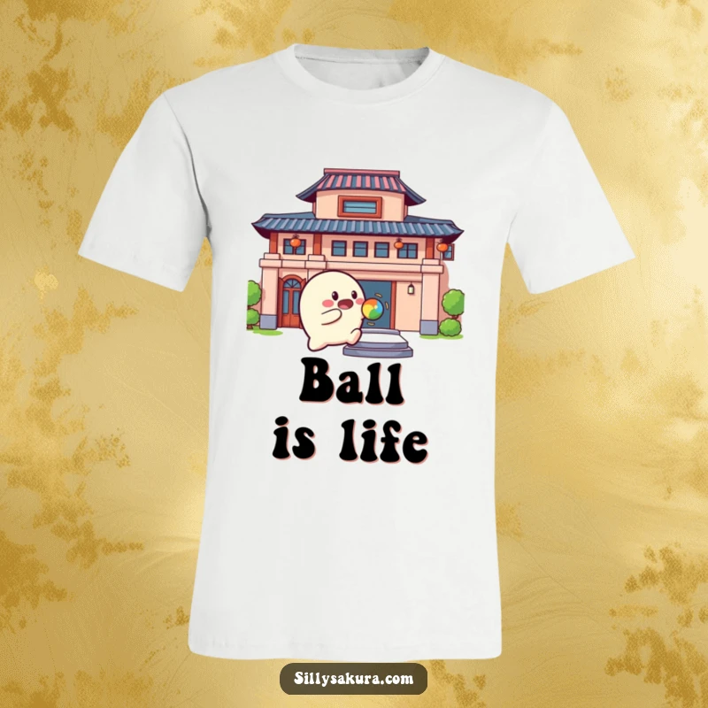 Funny T-Shirt with a rounded character cheerfully bouncing a colorful ball against a building, depicting playful energy.