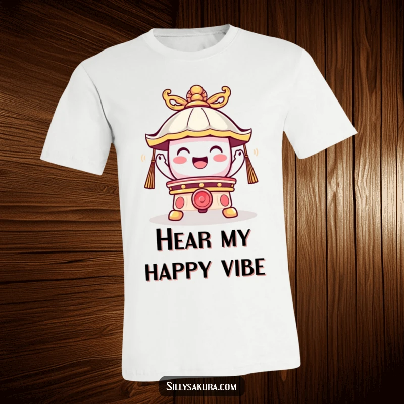 Funny t-shirt showcasing a cute temple bell character ringing with a powerful, joyful vibration and a humorous aura.
