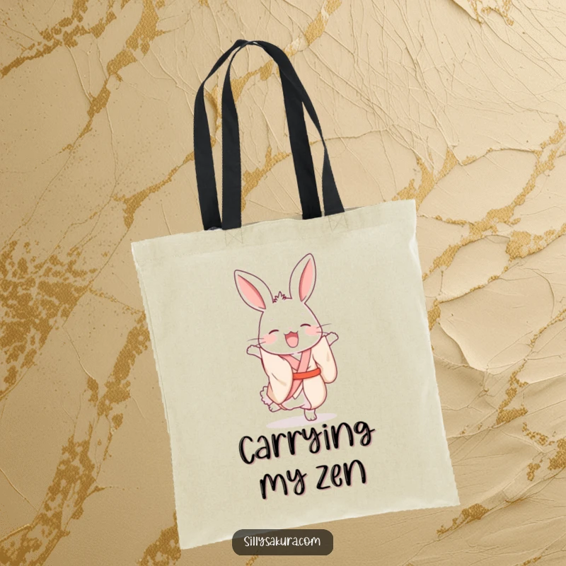 Funny giggling rabbit wearing a silk kimono, attempting a handstand on a stylish and humorous tote bag.